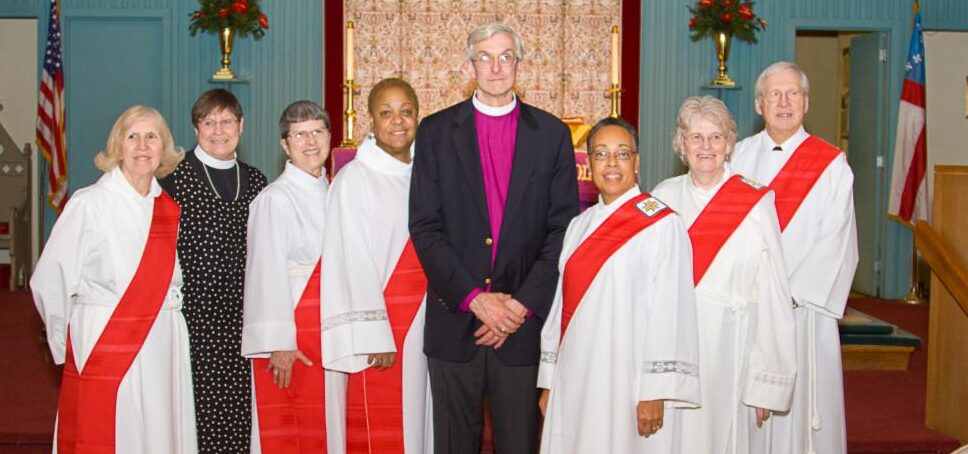 deacons pose with bishop wright at the 2020 ordination