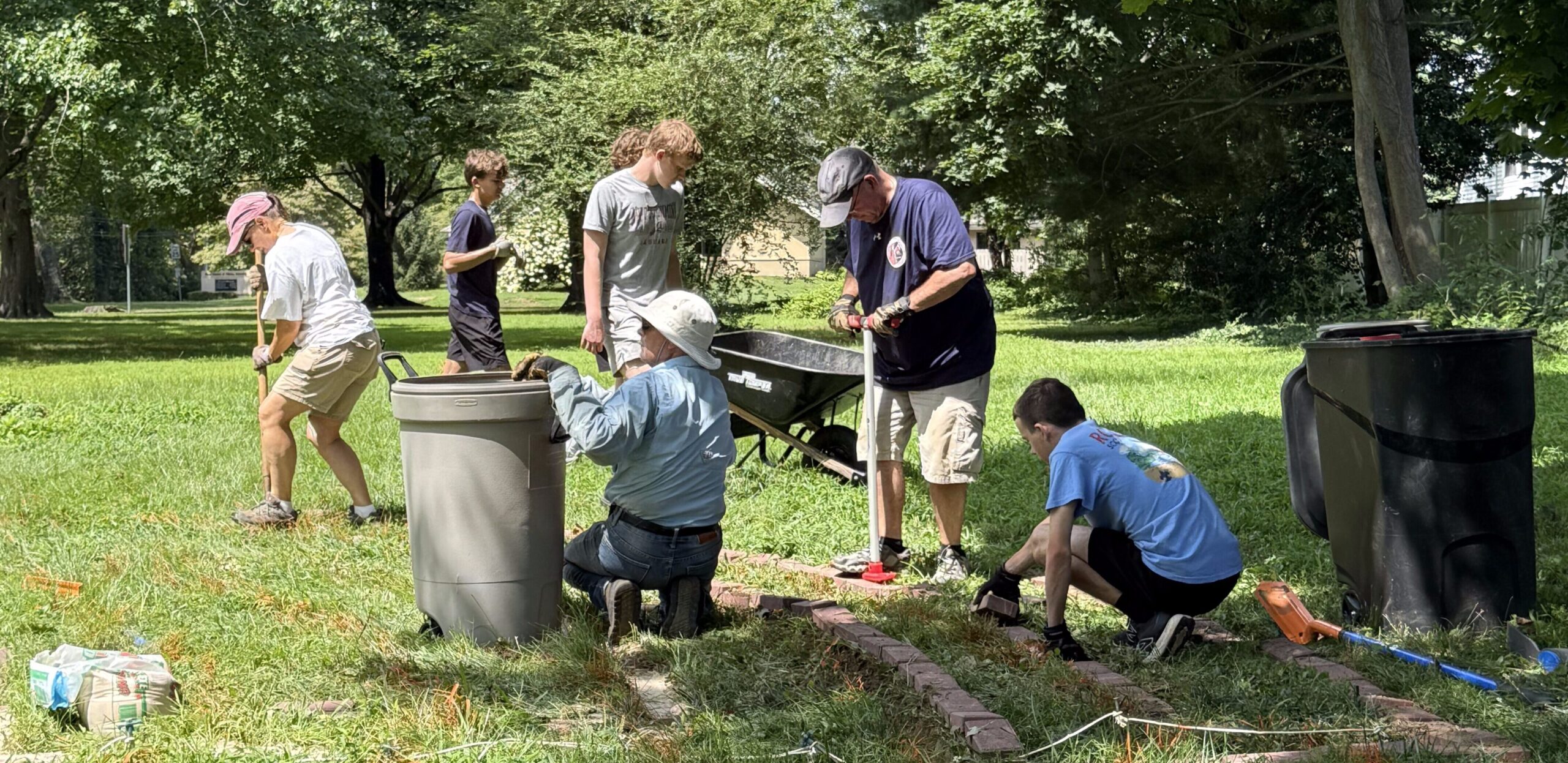 members and scout working on labyrinth project at St. Thomas's Parish in Newark