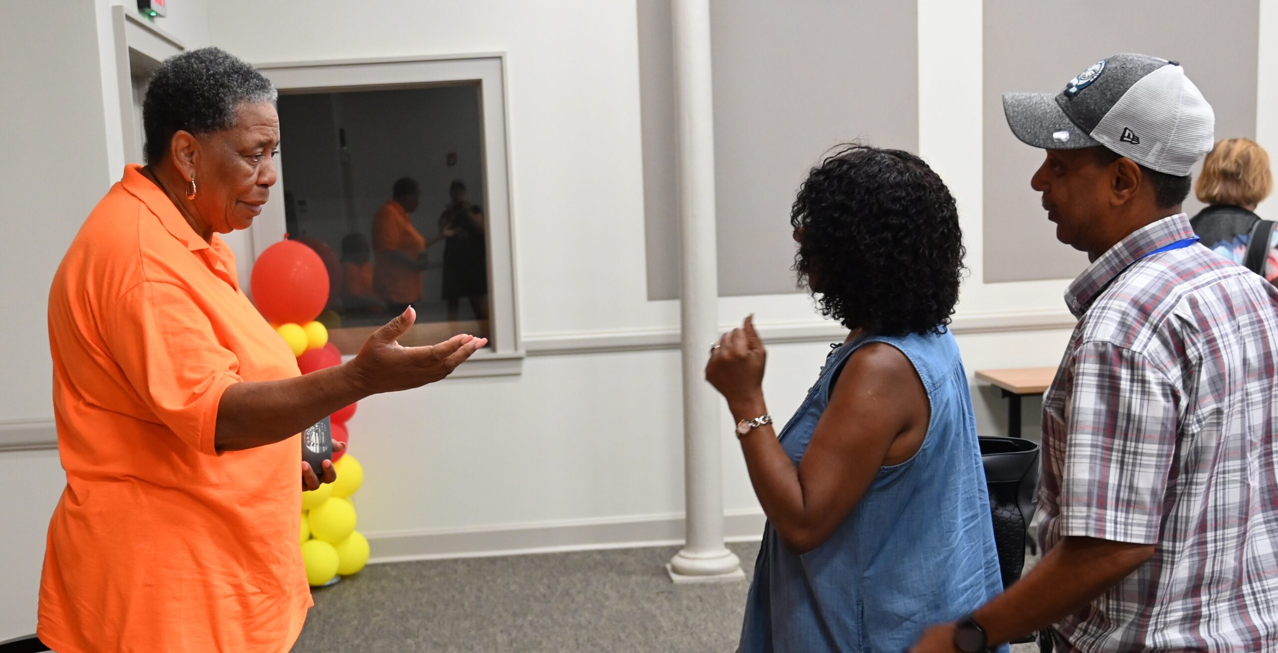 pilgrims talking with Jo Ann Bland
